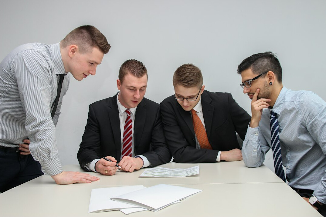 team discussing insurance software